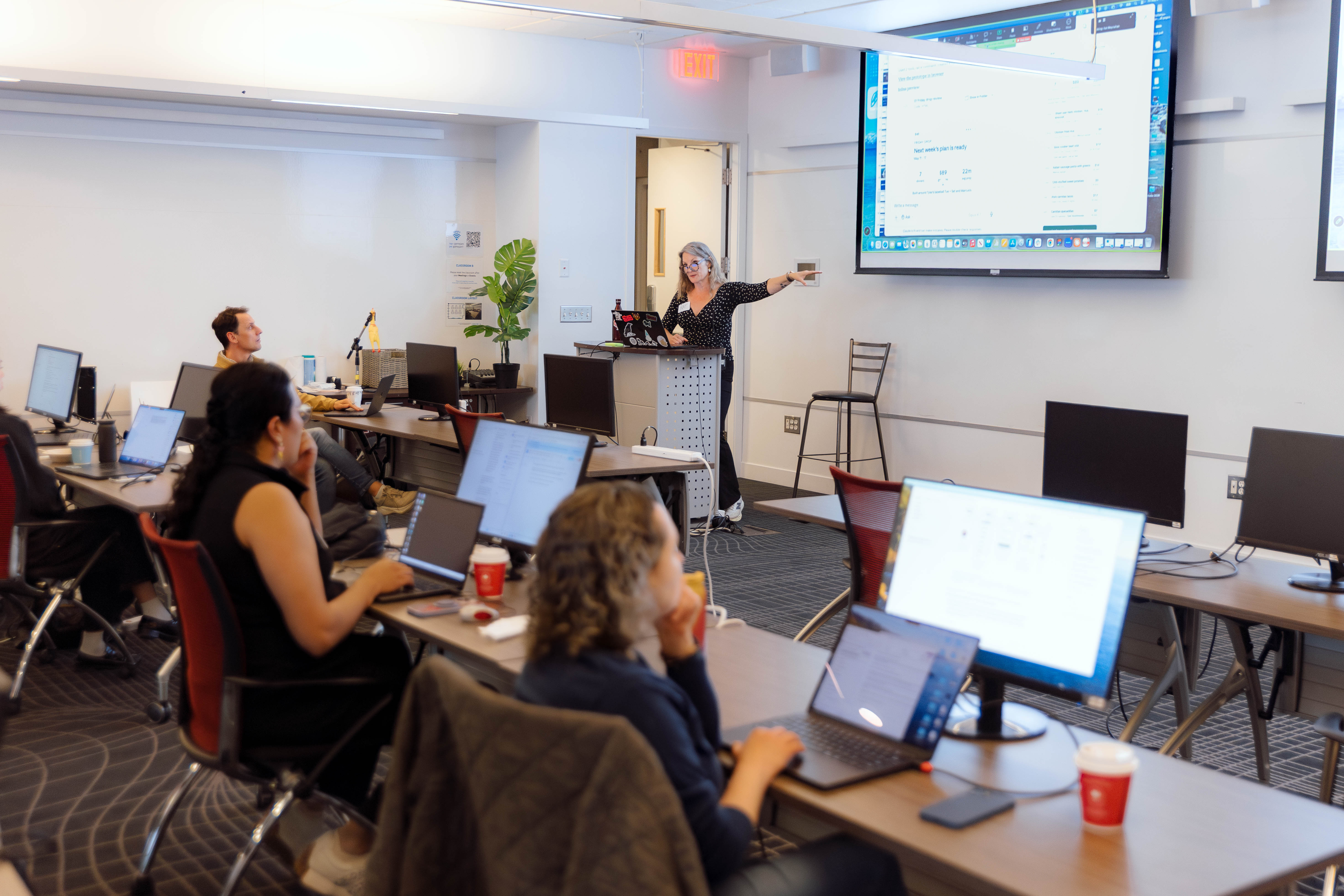 The room at the Center for Digital Media — working designers and PMs at the start of the day